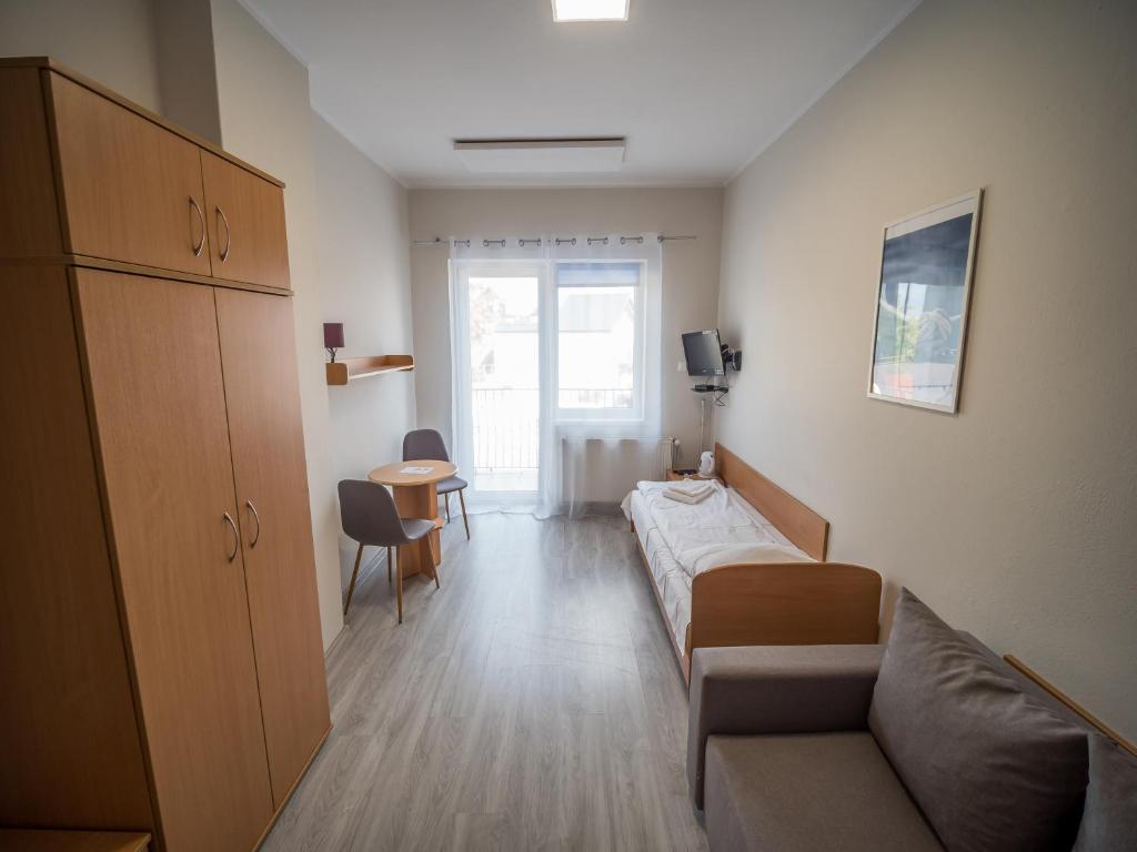 Postel nebo postele na pokoji v ubytování Meduza ośrodek wczasowy