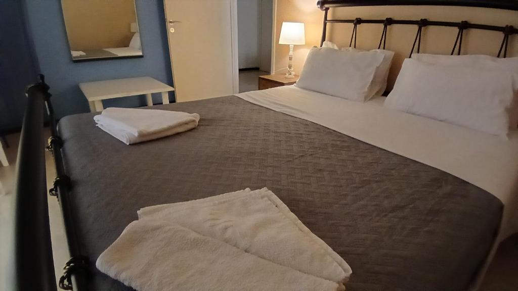 Postel nebo postele na pokoji v ubytování Ipsos apartment
