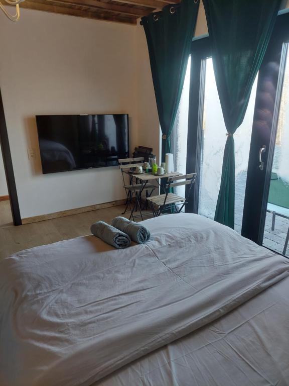 Postel nebo postele na pokoji v ubytování Le châtelain de Bouillon