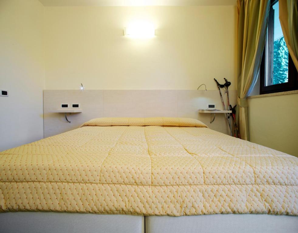 Postel nebo postele na pokoji v ubytování Hotel Alaska