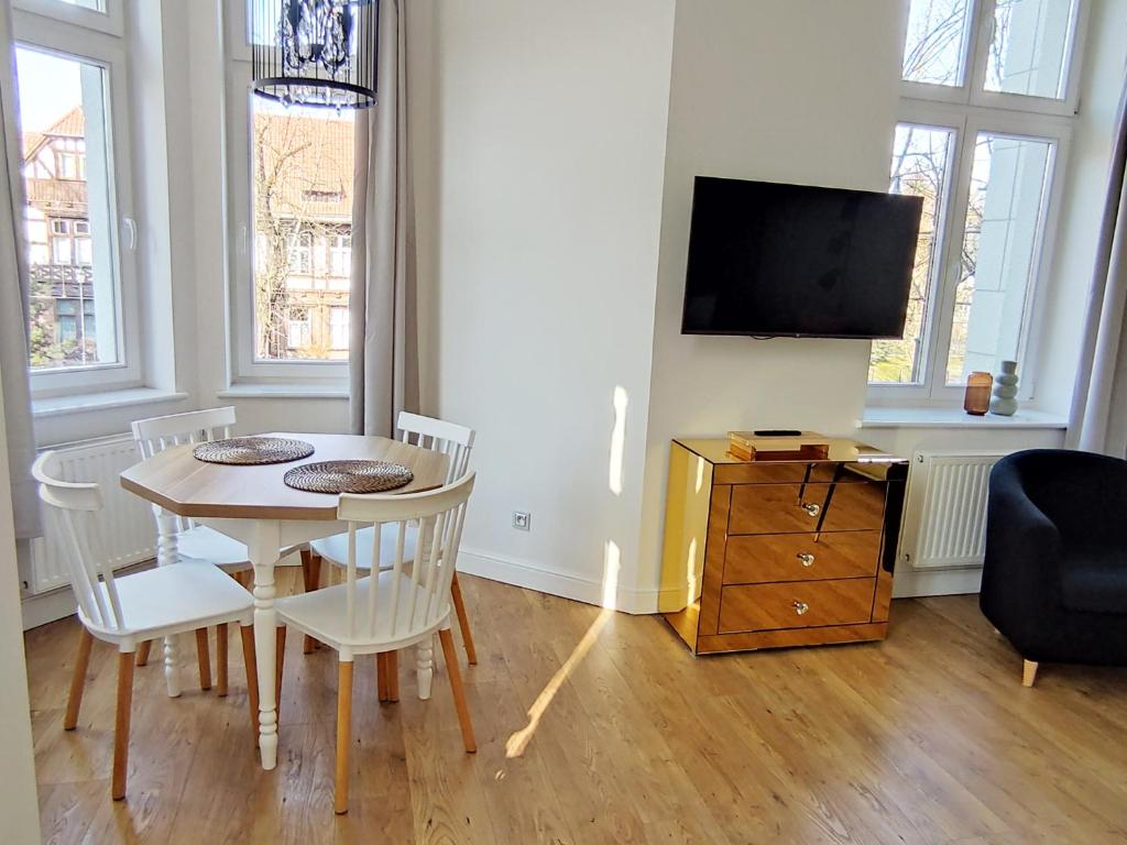 Televízia a/alebo spoločenská miestnosť v ubytovaní Boho Apartments