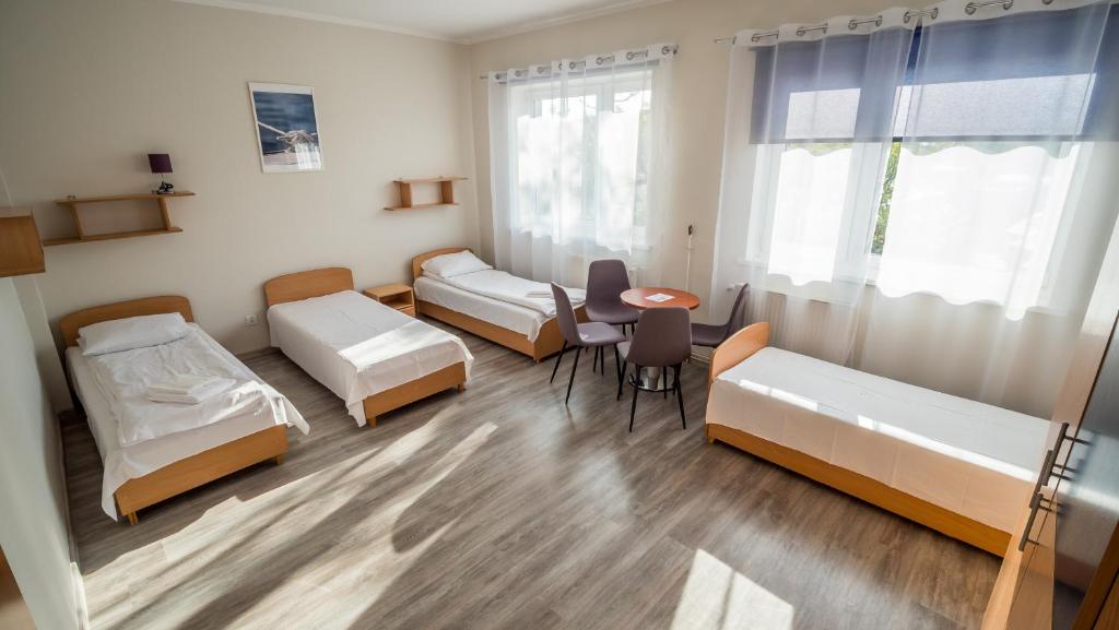 Postel nebo postele na pokoji v ubytování Meduza ośrodek wczasowy