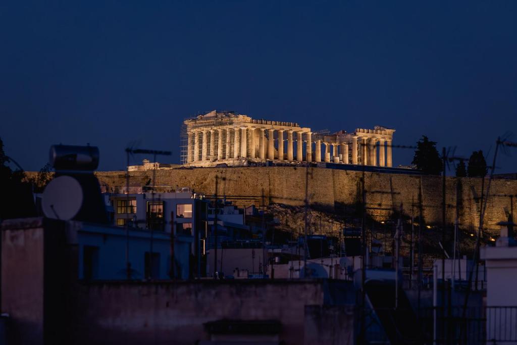 a view of the acropolis at night at Paradise Heated Jacuzzi with Acropolis View in Athens