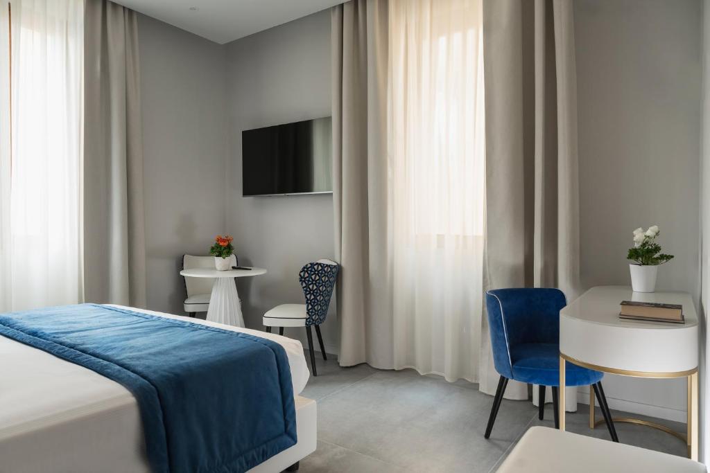 Postel nebo postele na pokoji v ubytování Hotel Parma e Oriente Wellness & Spa