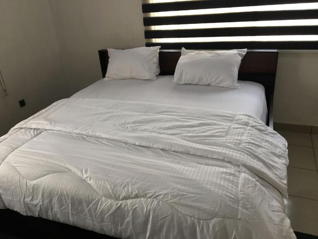 Postel nebo postele na pokoji v ubytování SLA shortlets