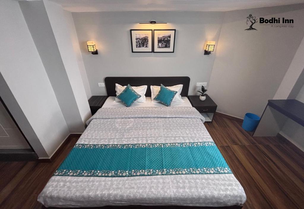 Postel nebo postele na pokoji v ubytování Bodhi Inn Homestay