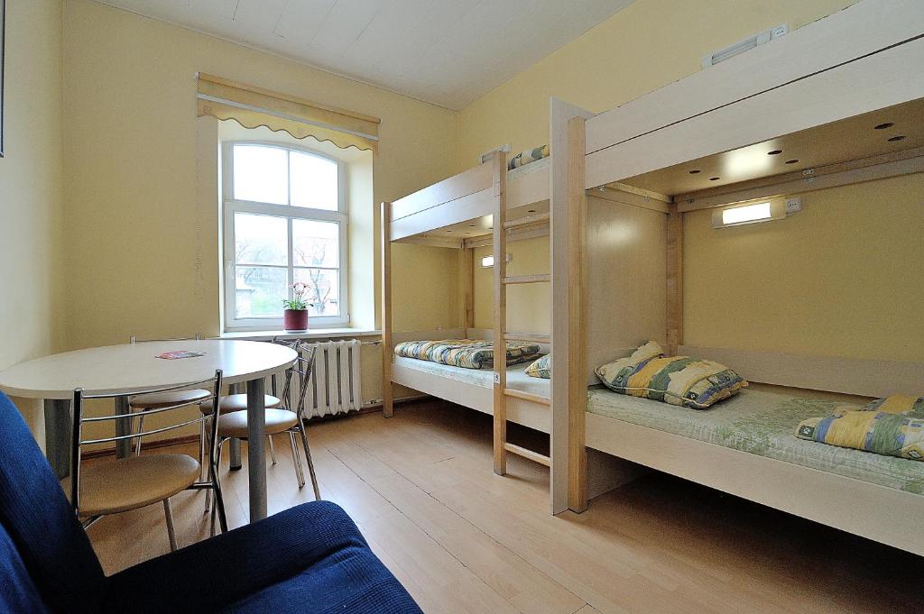 Postel nebo postele na pokoji v ubytování Hostel Filaretai