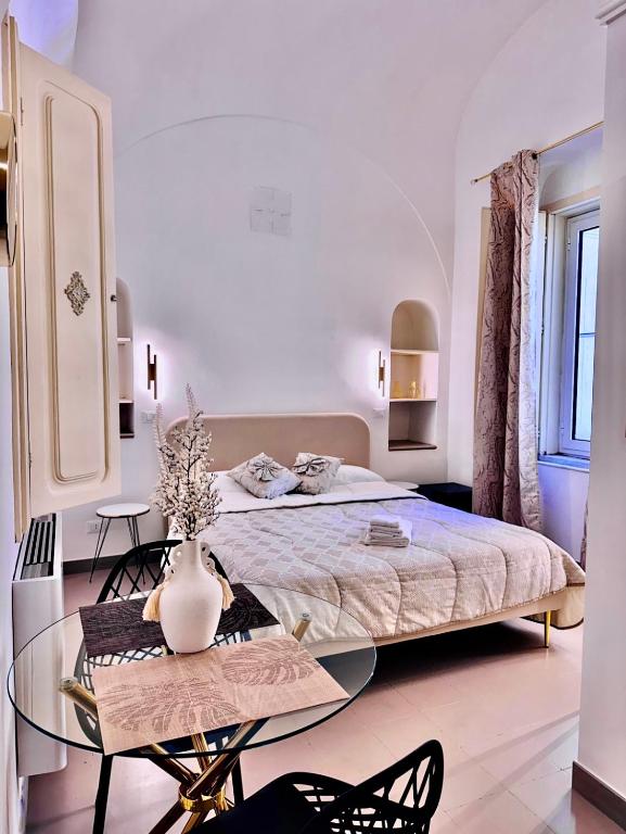 Postel nebo postele na pokoji v ubytování La Corte rooms