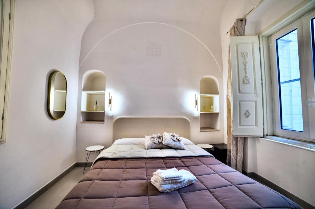 Postel nebo postele na pokoji v ubytování La Corte rooms