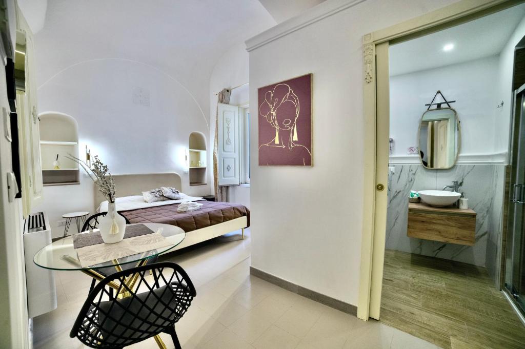 Postel nebo postele na pokoji v ubytování La Corte rooms