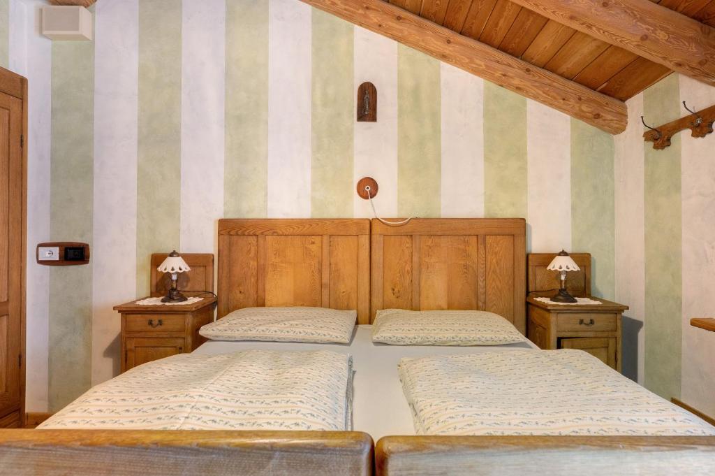 Postel nebo postele na pokoji v ubytování Agriturismo Alpenvidehof