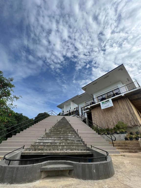 a group of stairs in front of a building at Escape Boutique Hotel in Puerto Princesa City