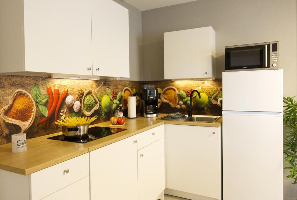 Kuchyň nebo kuchyňský kout v ubytování Ferienwohnung Storchennest