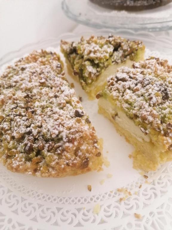 a plate with three pieces of cake on it at FONTEblu B&B in Polignano a Mare