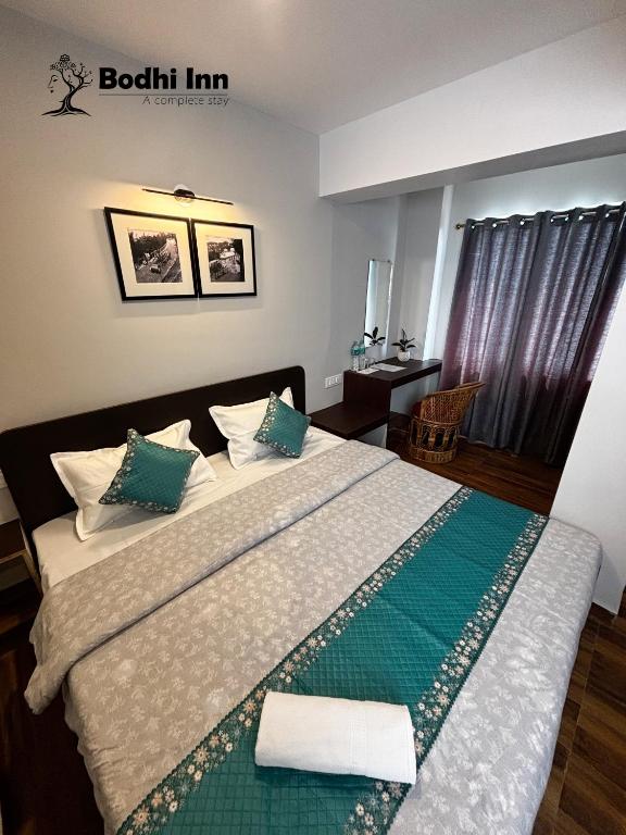 Postel nebo postele na pokoji v ubytování Bodhi Inn Homestay