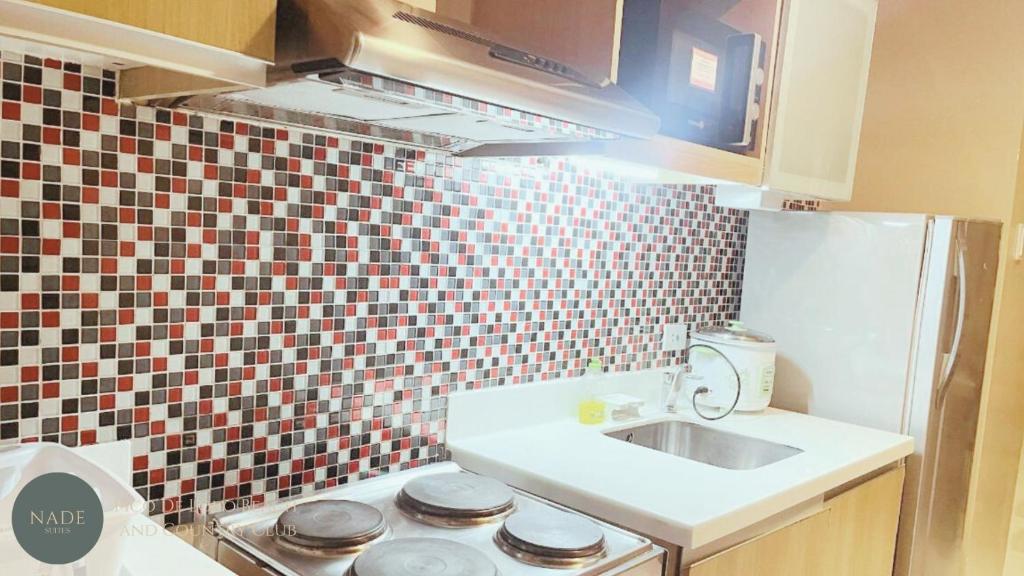 Kuchyň nebo kuchyňský kout v ubytování Nade Suites - Pico De Loro MIA 609