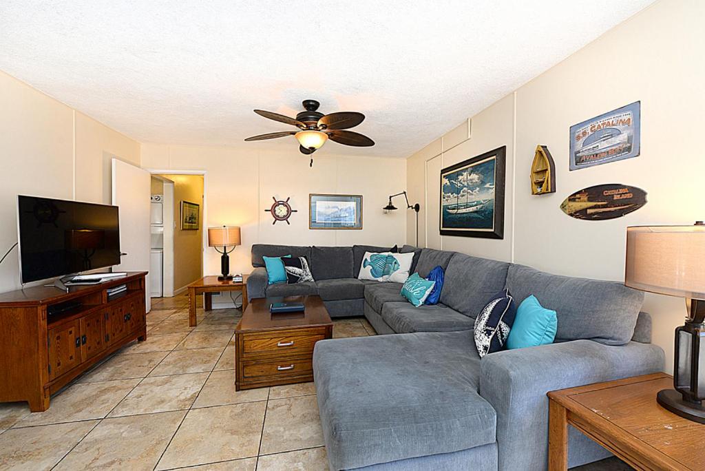 a living room with a couch and a ceiling fan at 315E Lower 315 Eucalyptus Lower in Avalon