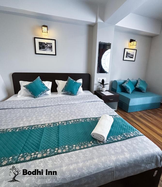 Postel nebo postele na pokoji v ubytování Bodhi Inn Homestay