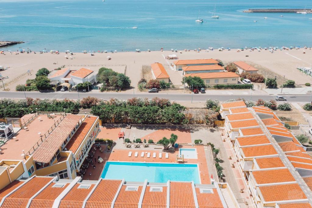 an aerial view of a resort and the beach at Hotel Malaspina in Bosa