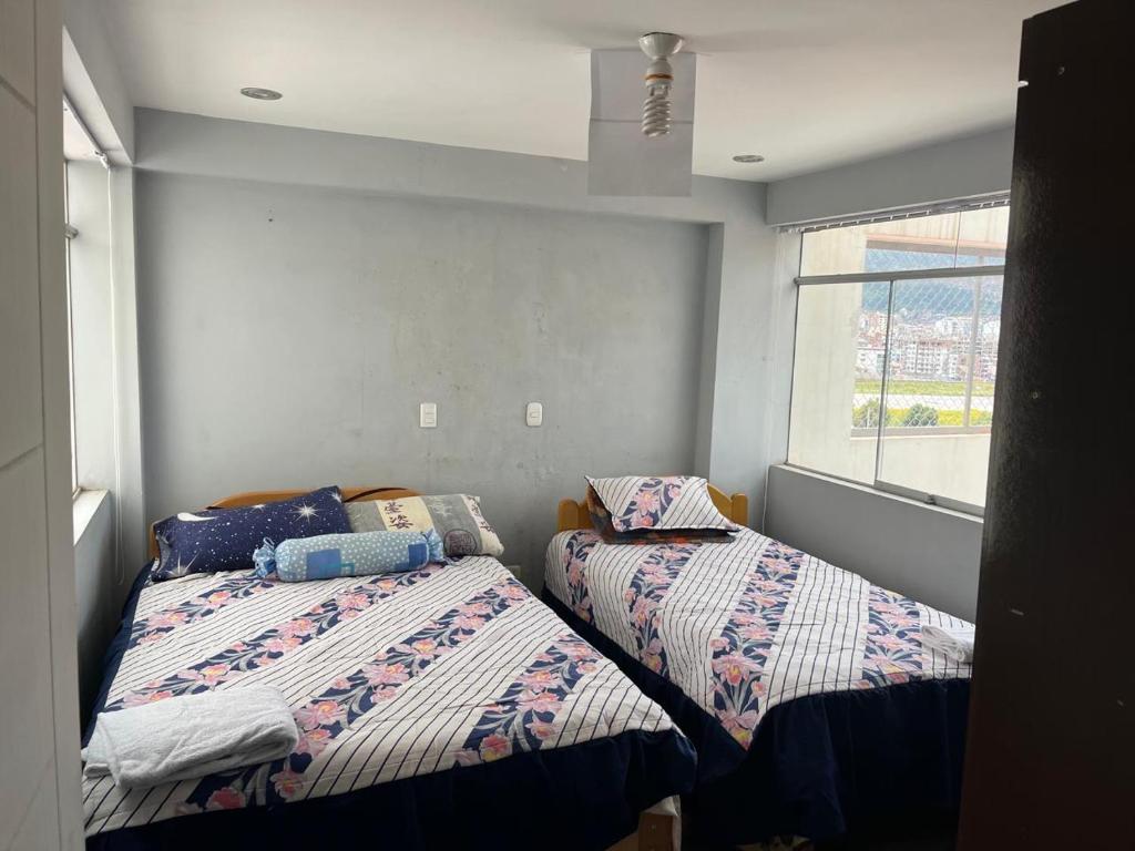 Ένα ή περισσότερα κρεβάτια σε δωμάτιο στο la casa de leo