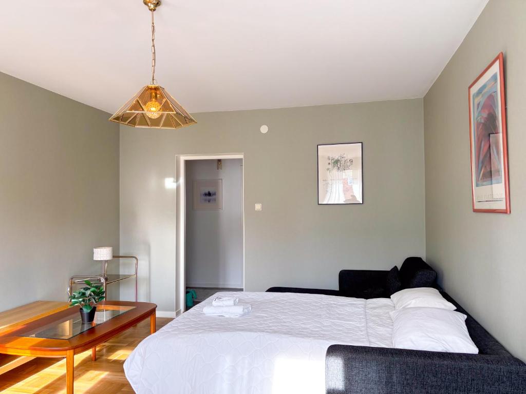Postel nebo postele na pokoji v ubytování Säffle Suites by Svaneholm Hotel