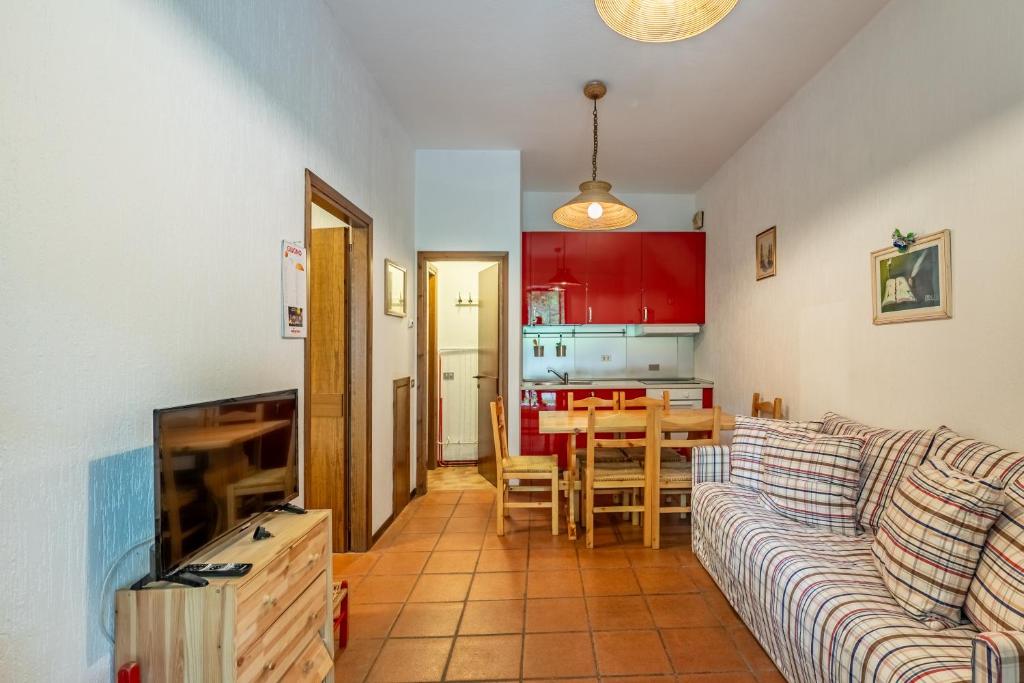 a living room with a couch and a table at Residence Sole - Adamello in Ponte di Legno
