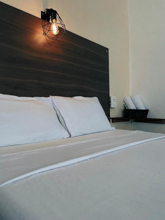 Postel nebo postele na pokoji v ubytování Origen Hostel Jardín