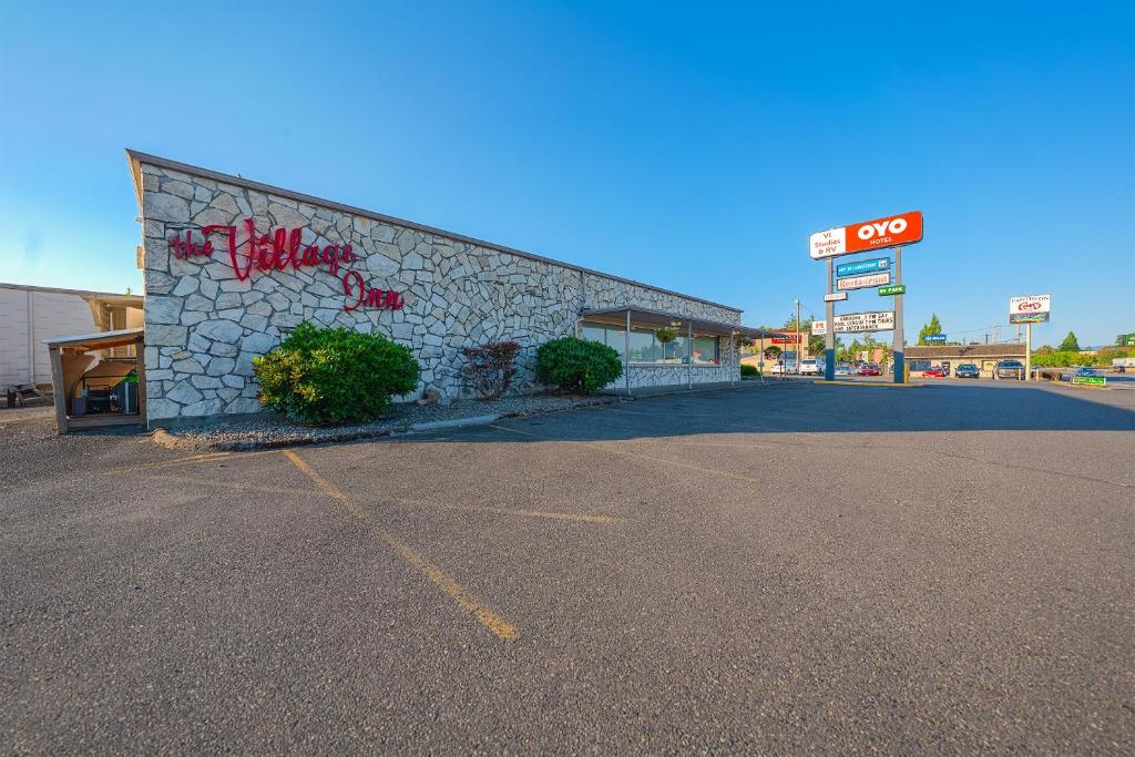 an empty parking lot in front of a gas station at OYO Hotel St Helens OR in Saint Helens