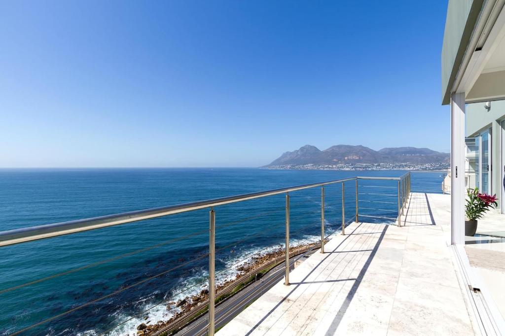 a view of the ocean from the balcony of a house at Sea Views Oceans Echo Villa in Fish Hoek