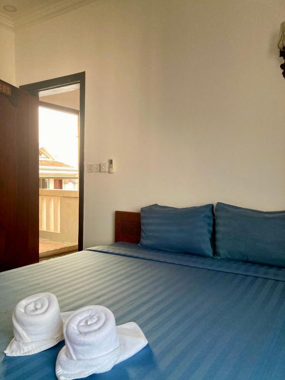 Postel nebo postele na pokoji v ubytování Lotus Haven Villa