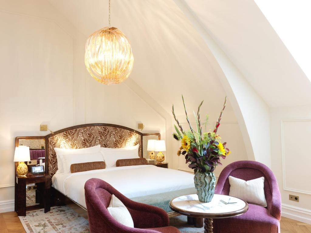 Postel nebo postele na pokoji v ubytování Hotel Fleur de Ville