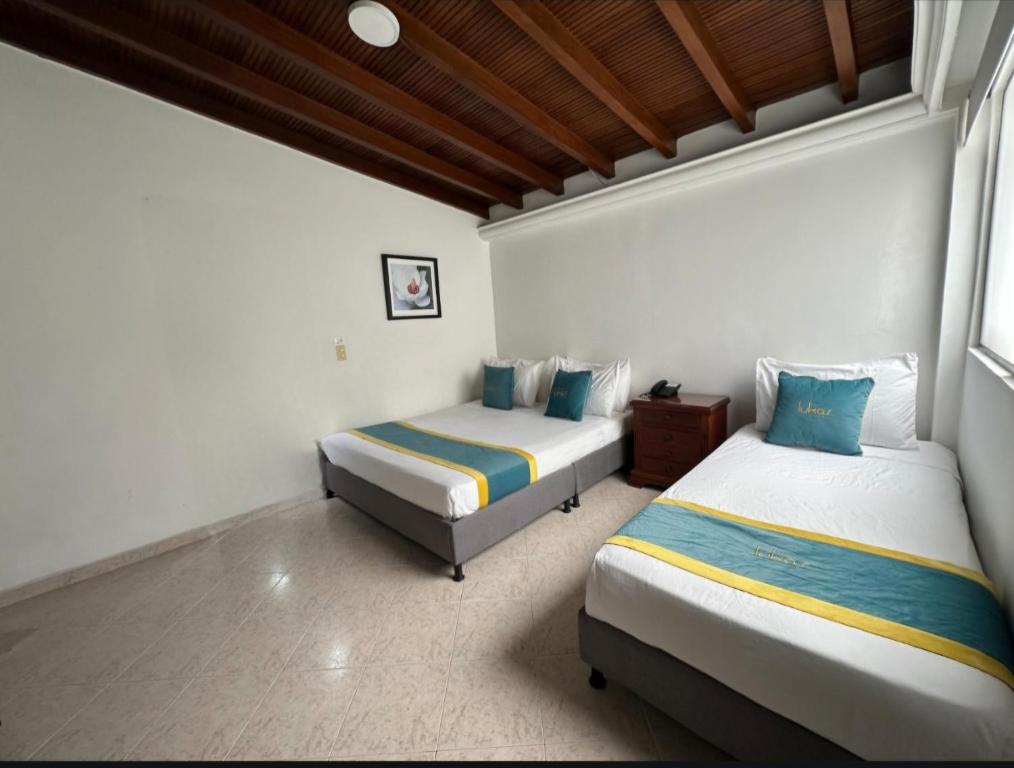 Postel nebo postele na pokoji v ubytování Hotel Lukas