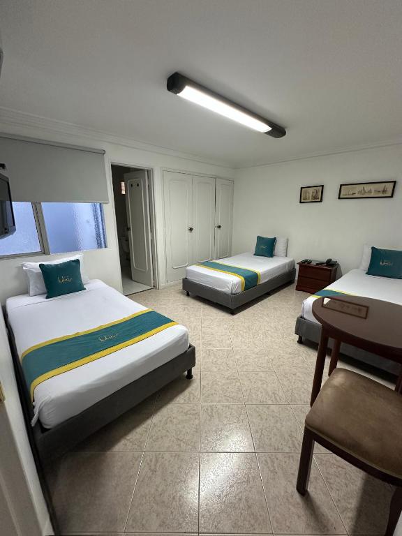 Postel nebo postele na pokoji v ubytování Hotel Lukas