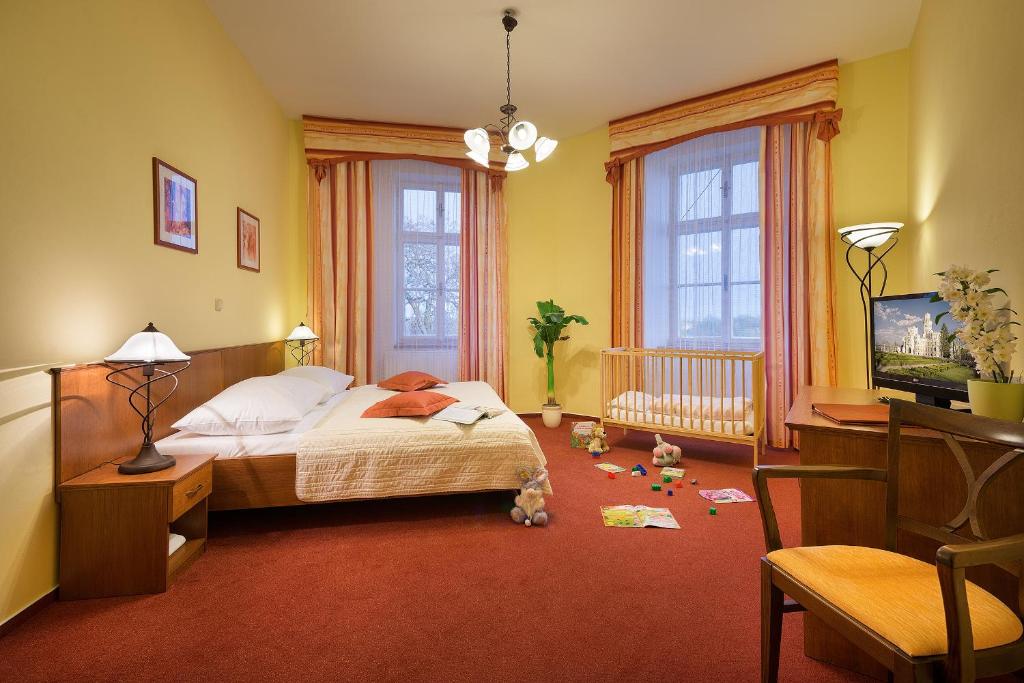 Postel nebo postele na pokoji v ubytování Residence Knížecí Dvůr