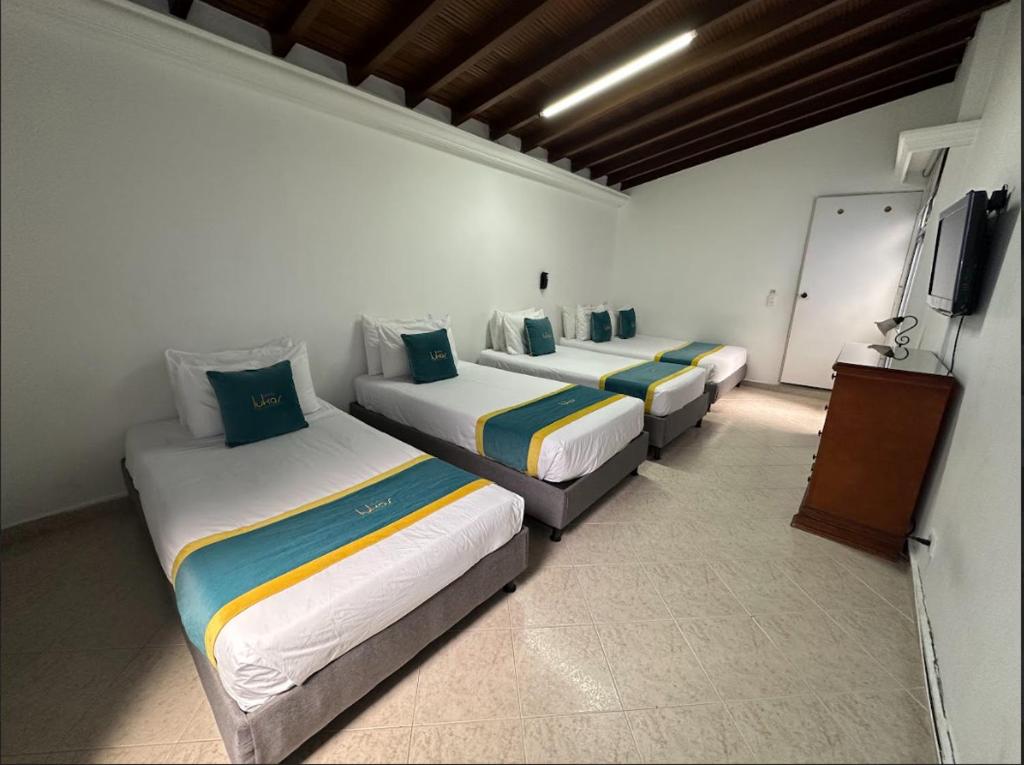 Postel nebo postele na pokoji v ubytování Hotel Lukas