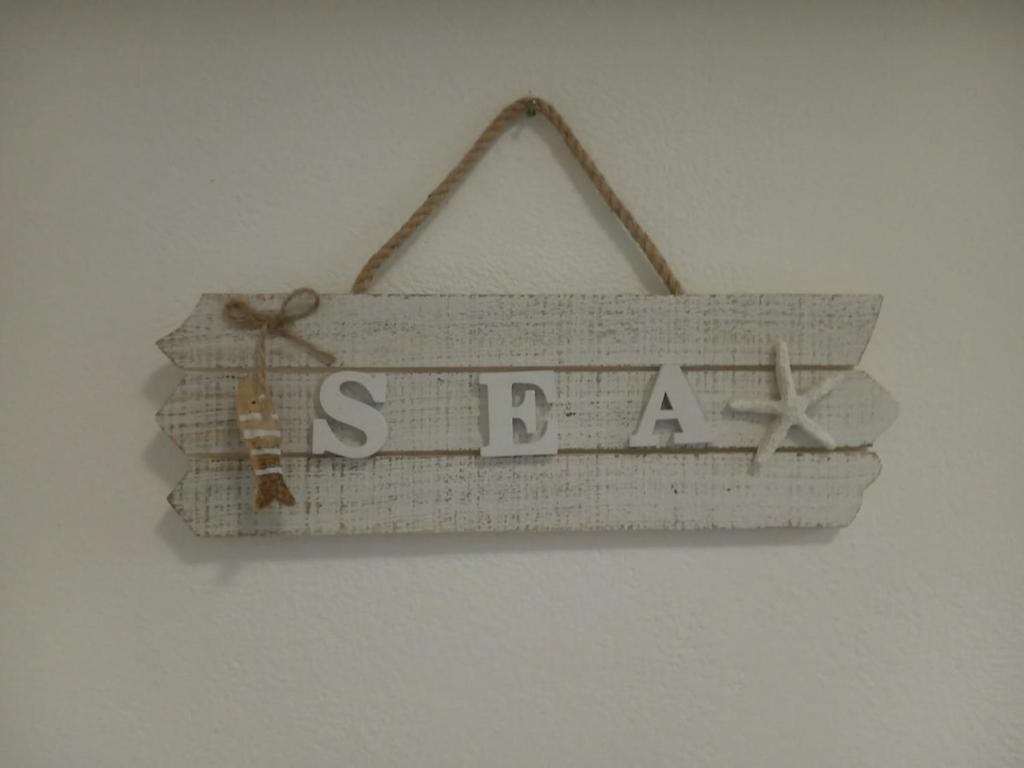 a sign that says santa hanging on a wall at Da Cate in Monterosso al Mare