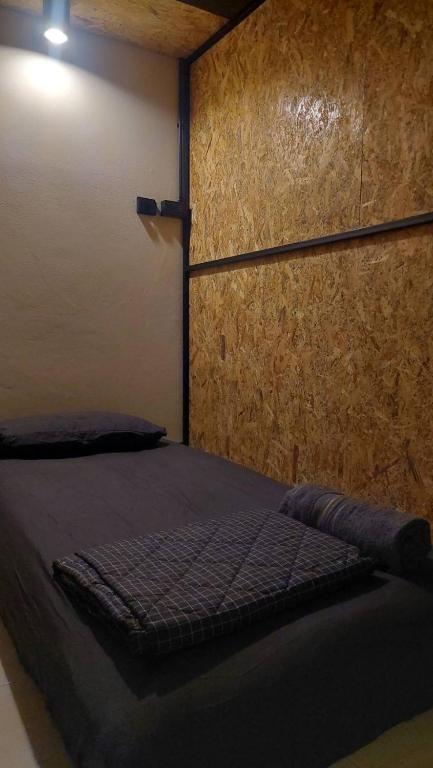 Postel nebo postele na pokoji v ubytování Outback Hostel & Community