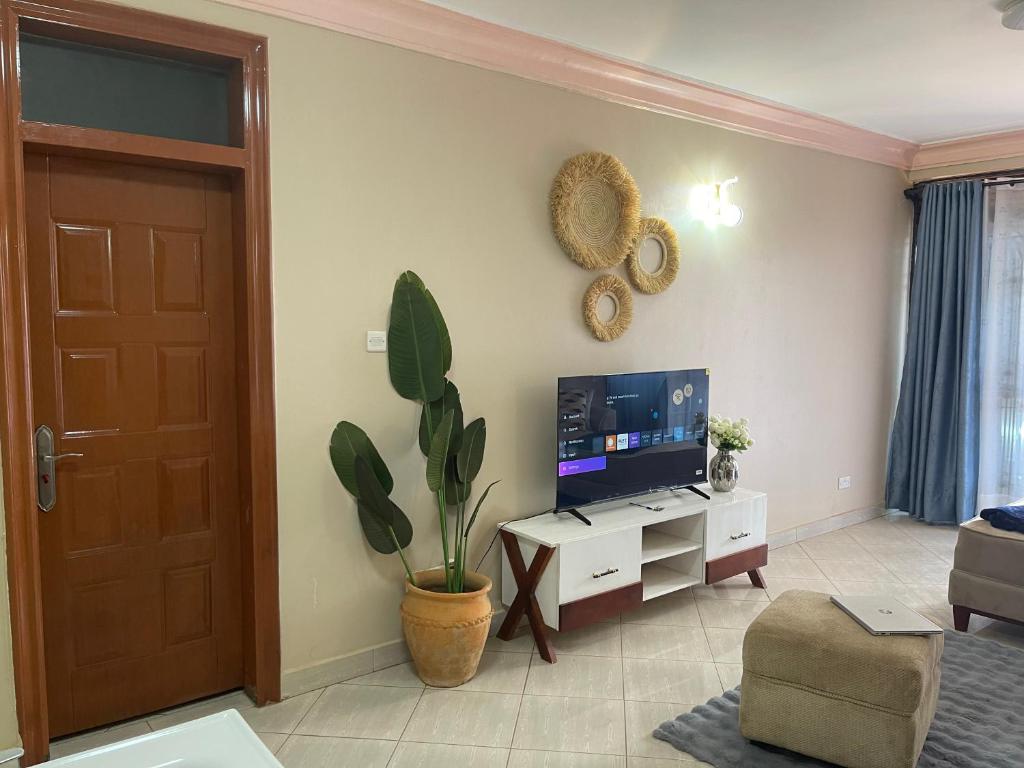 Fotografie z fotogalerie ubytování Cosy roadside apartment with fiber internet v destinaci Kampala