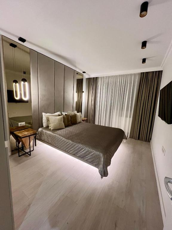 Katil atau katil-katil dalam bilik di Hils Hotel Apartment by Warm