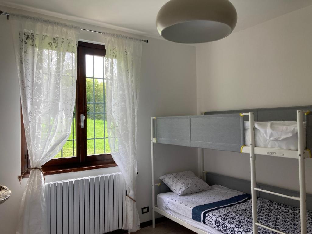 Postel nebo postele na pokoji v ubytování Villa Vinea Prisca B&B