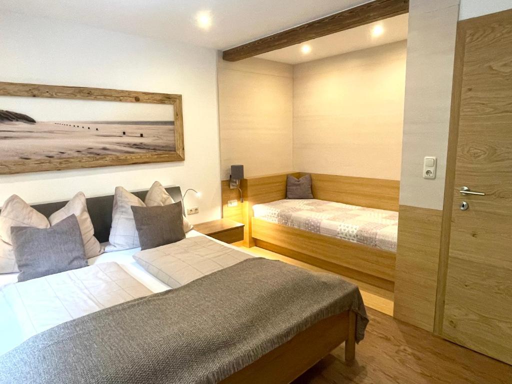 Posteľ alebo postele v izbe v ubytovaní Haus Füsslmühle