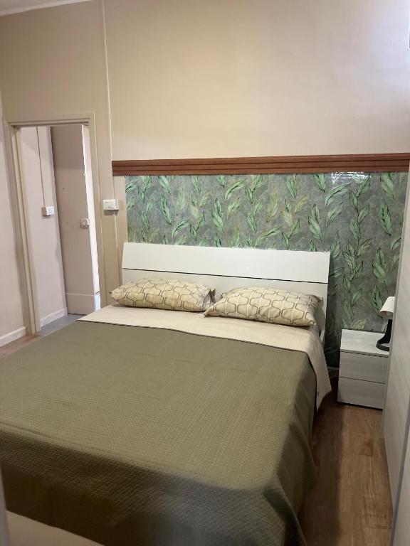 Postel nebo postele na pokoji v ubytování Appartamenti Minturnae Relais