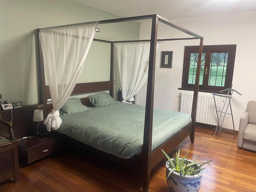 Postel nebo postele na pokoji v ubytování Villa Vinea Prisca B&B