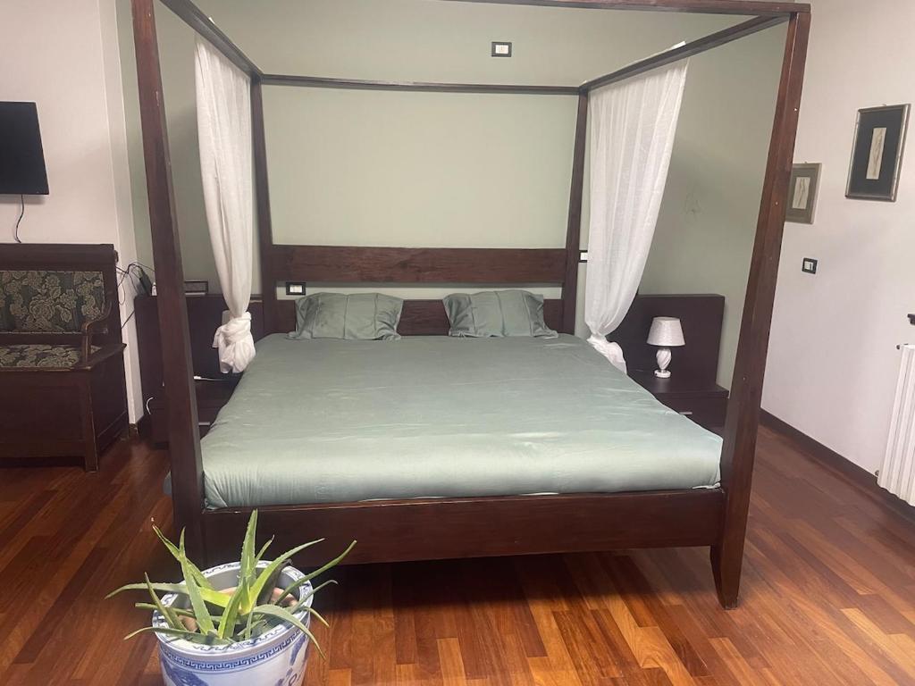 Postel nebo postele na pokoji v ubytování Villa Vinea Prisca B&B