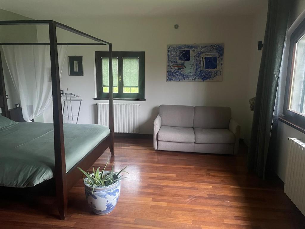 Postel nebo postele na pokoji v ubytování Villa Vinea Prisca B&B
