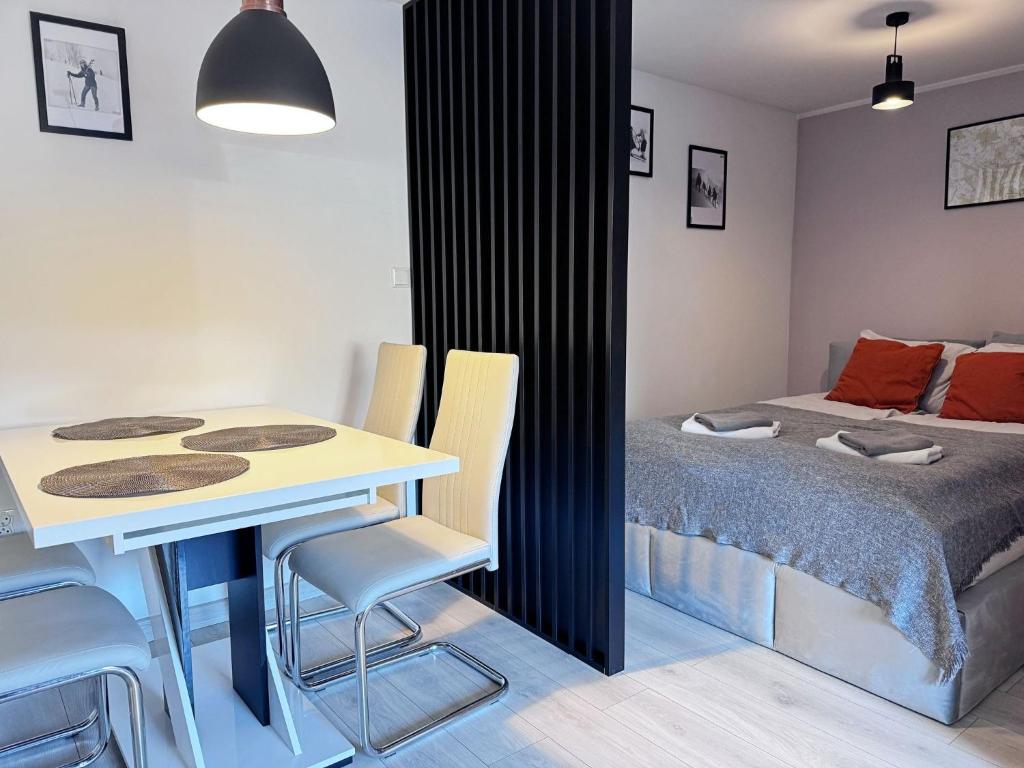 Postel nebo postele na pokoji v ubytování Apartament Dzikowiec