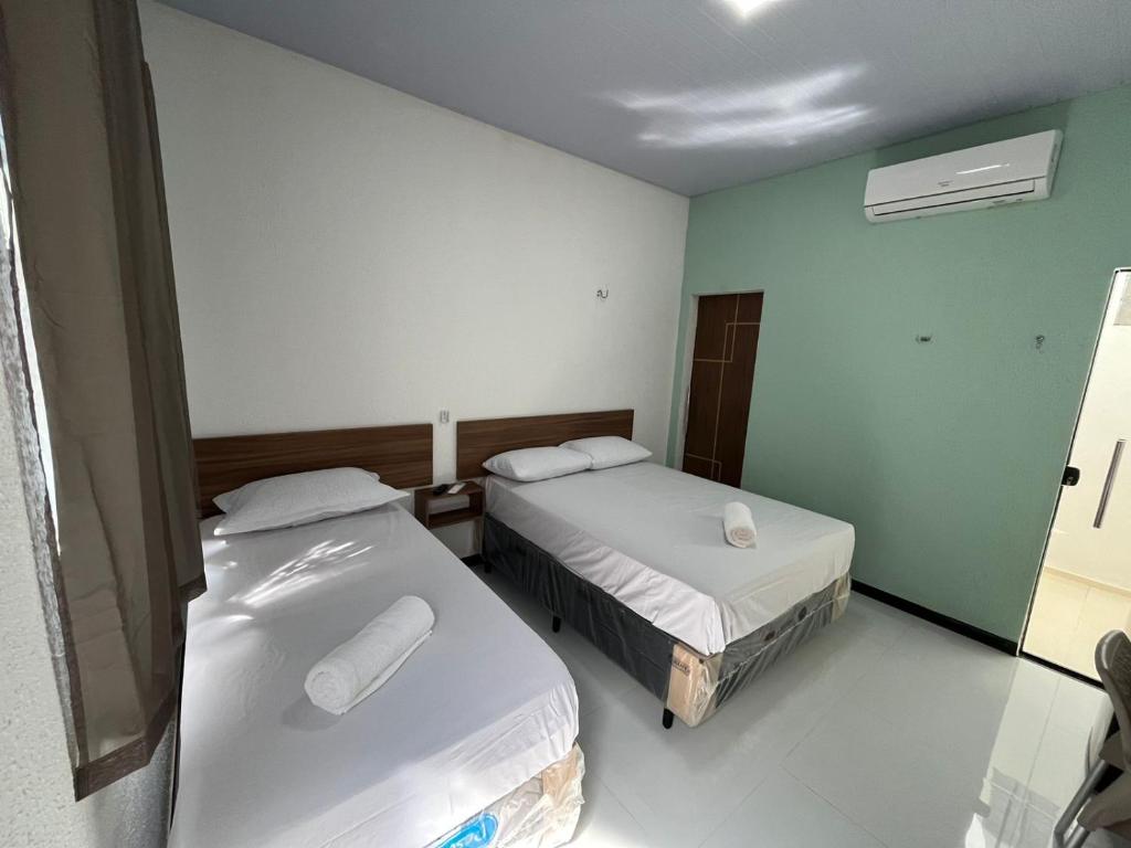Postel nebo postele na pokoji v ubytování Hotel GAB RESIDENCIAL