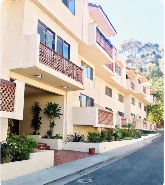 an apartment building with balconies on a street at Bahia Vista C53 in Avalon