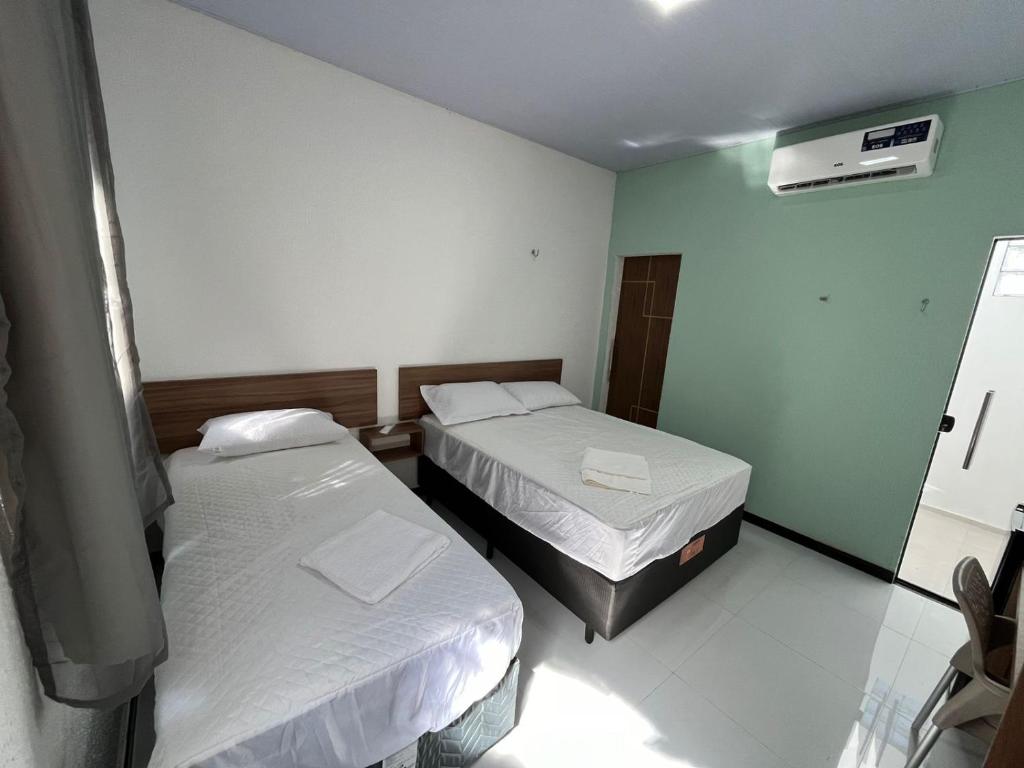 Postel nebo postele na pokoji v ubytování Hotel GAB RESIDENCIAL