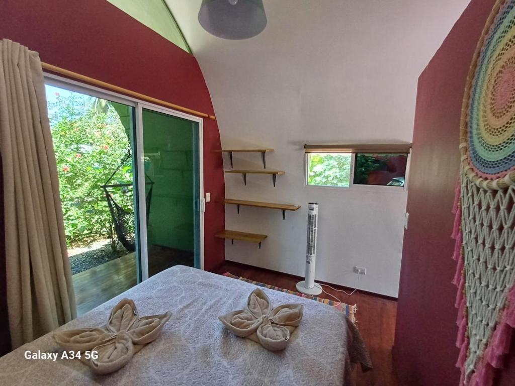 Postel nebo postele na pokoji v ubytování Domos del Caribe